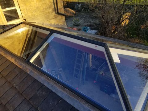 Glazed roof lantern installed on a flat-roof extension